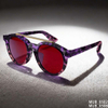 Sophisticated Round Double-Bridge Sunglasses with Transparent Frames and Red Lenses
